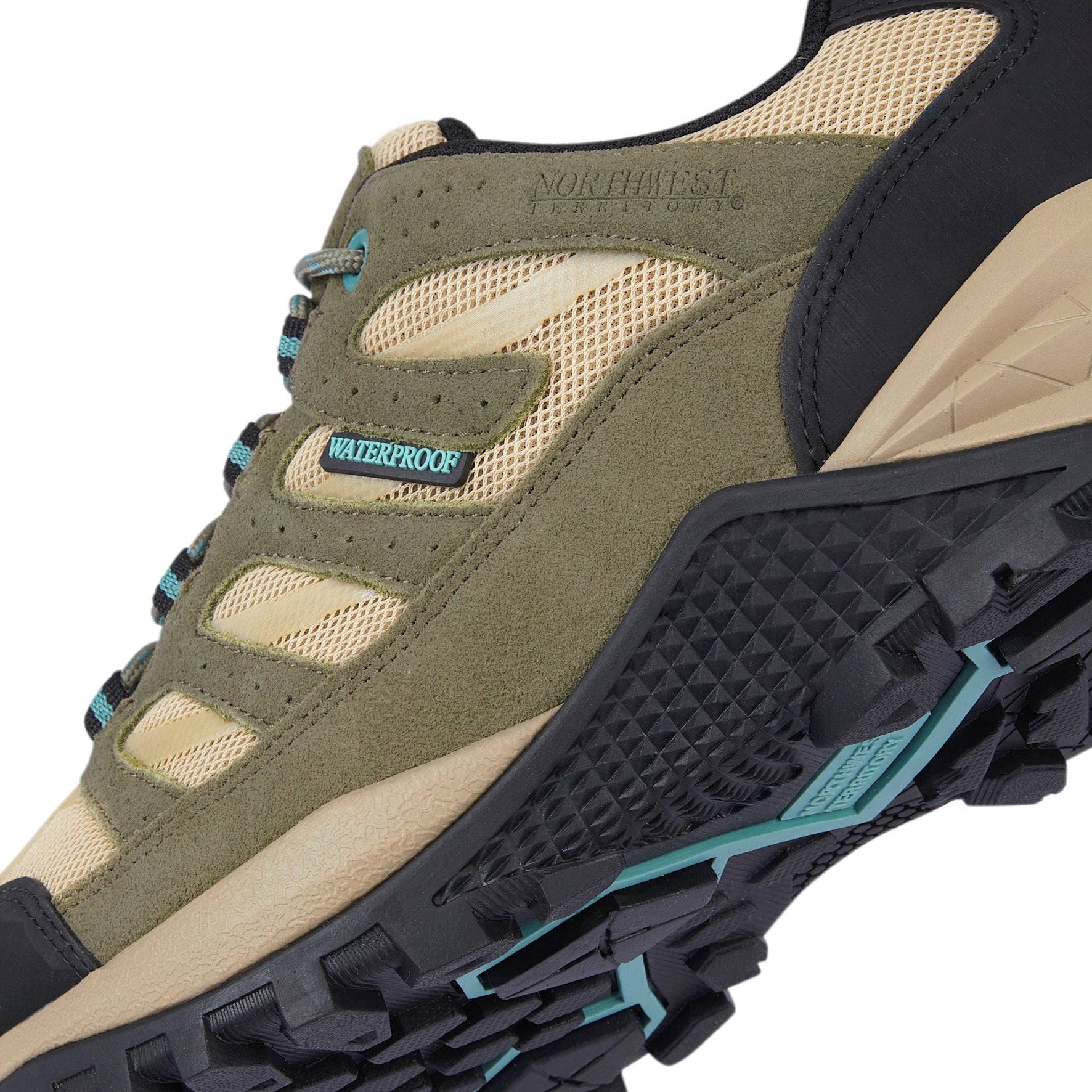 Man wearing RANGER Green suede leather waterproof walking shoes while walking on a British countryside trail during summer.
