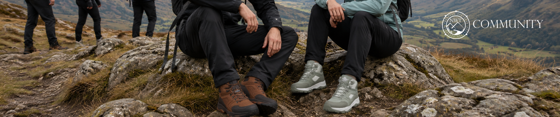 Couple wearing waterproof walking boots and hiking clothing while walking through the British countryside