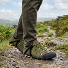 Man wearing GLYDER Ranger Green waterproof walking shoes while walking through the British countryside during summer.
