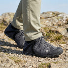 Man wearing GLYDER suede leather waterproof walking shoes while walking through the British countryside during summer.