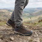 Man wearing Steen men's suede leather waterproof walking shoes while hiking on UK countryside trails, offering waterproof comfort, grip and all-day support.